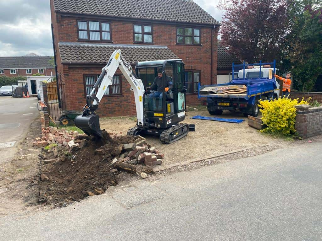 This is a photo of an operative of Whitstable Driveways Digging out for a new tarmac driveway